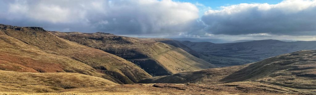 landscape image of moors and hills over Edale and Kinder