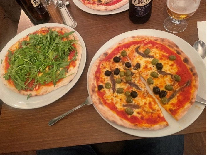 photo of two pizzas